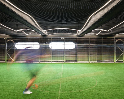 absence from island + studio etain ho turn a factory unit into a soccer pitch in hong kong