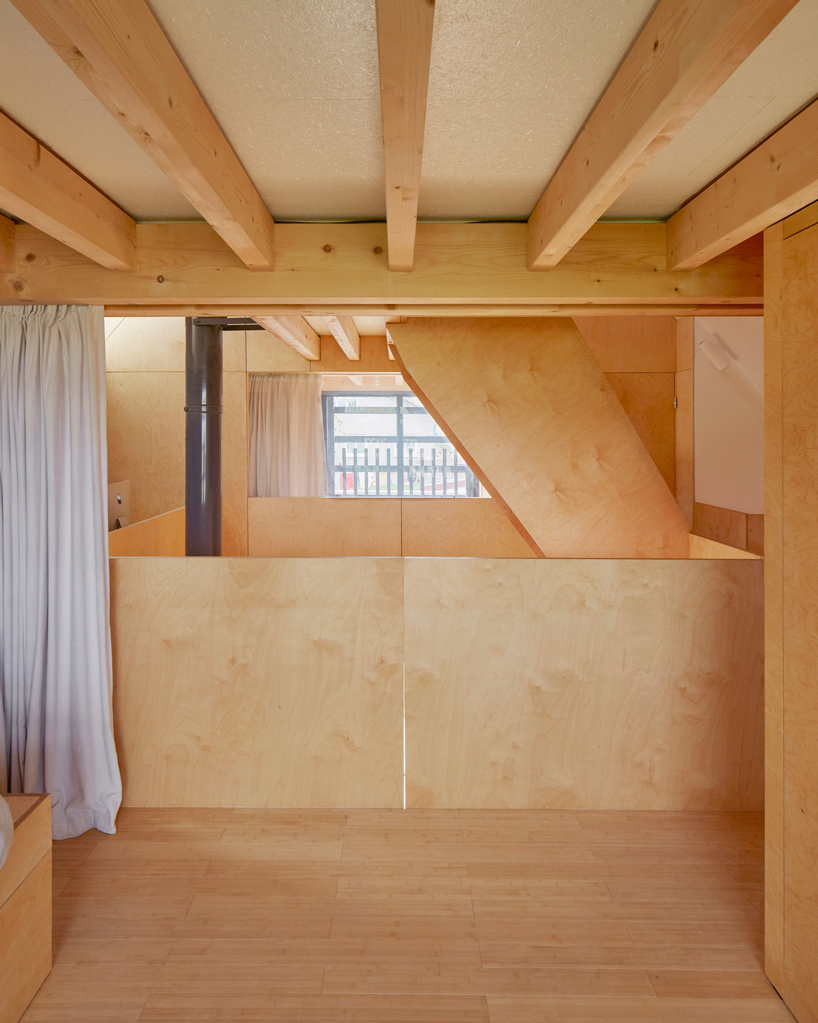 arba builds a timber house between two old stone walls in rural france - 14