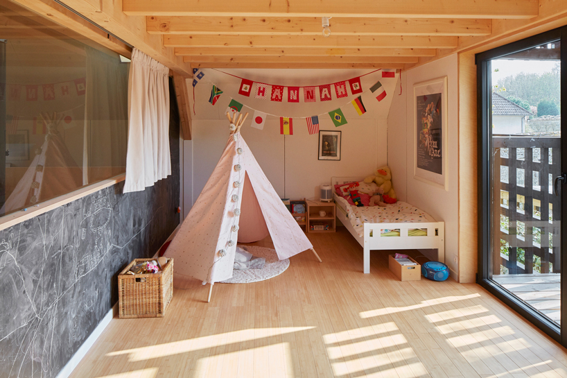 arba builds a timber house between two old stone walls in rural france - 15
