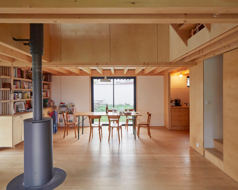 arba builds a timber house between two old stone walls in rural france - 7