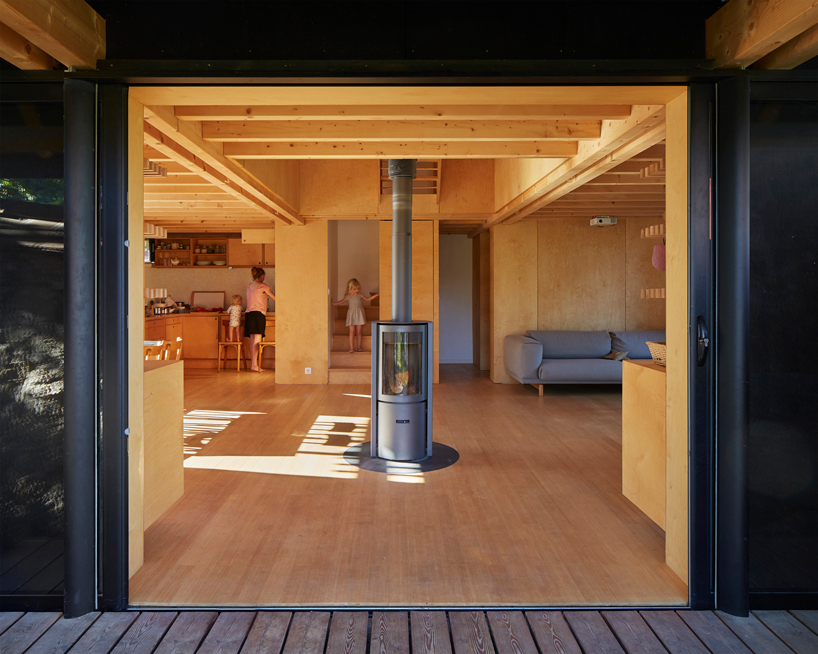 arba builds a timber house between two old stone walls in rural france - 5