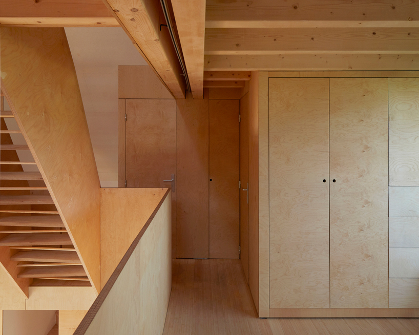 arba builds a timber house between two old stone walls in rural france - 10