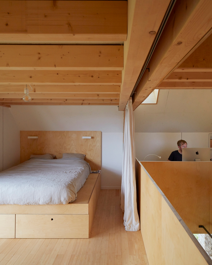 arba builds a timber house between two old stone walls in rural france - 11
