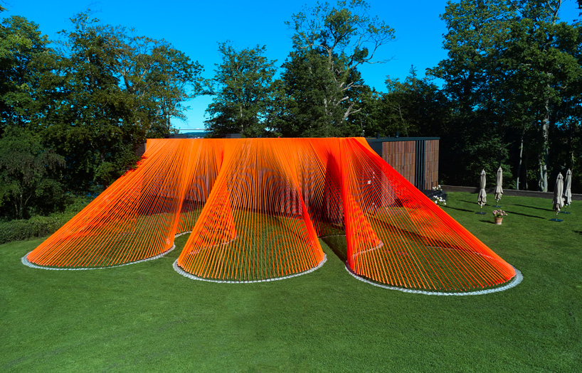 behin ha's bright orange, mesh fabric installation in denmark
