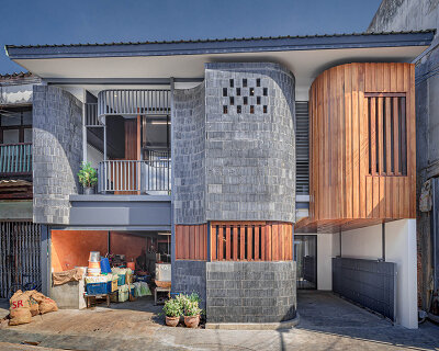 bodinchapa architects clads thai house + family business building in brick and wood façade