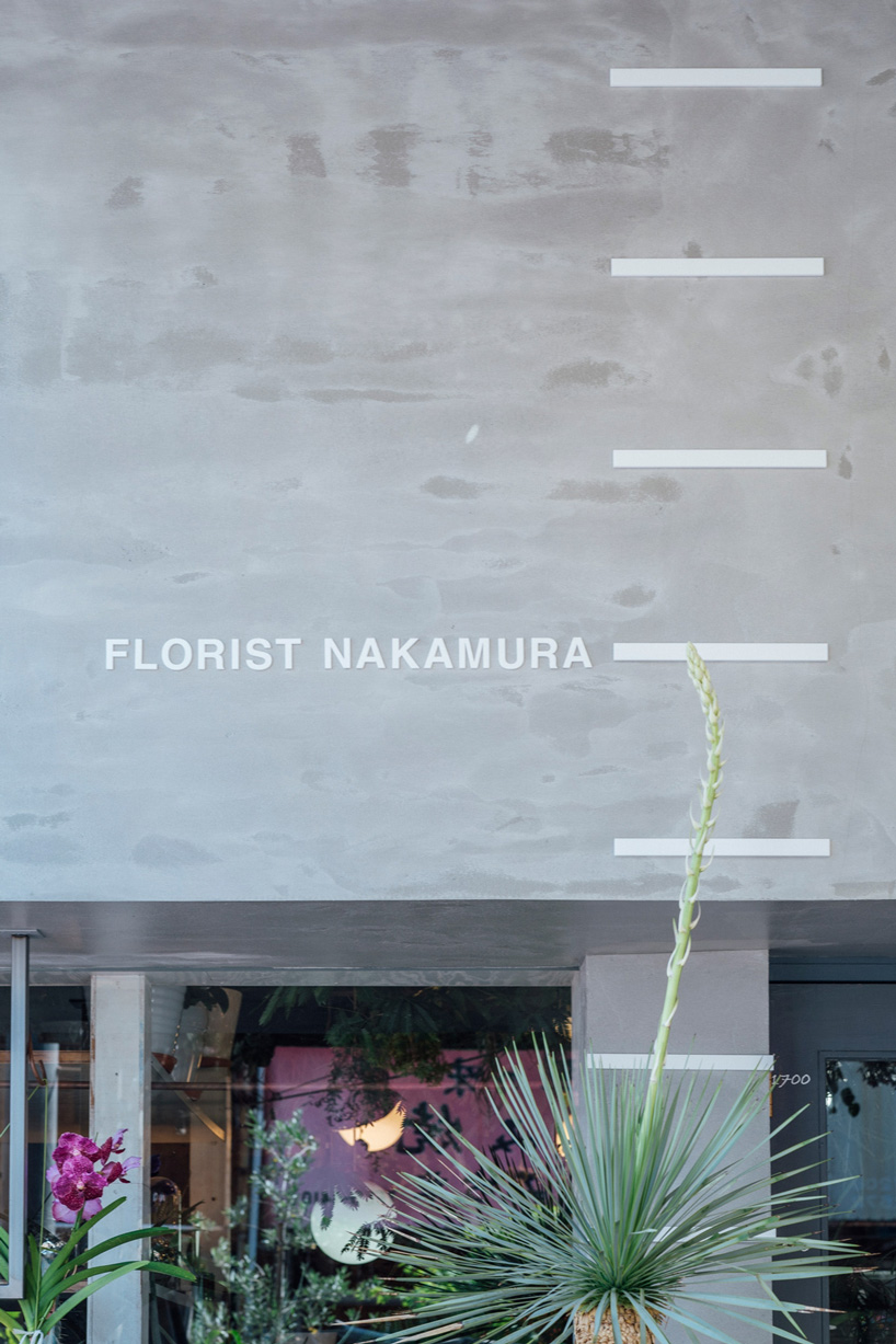 fathom completes the concrete façade of this japanese flower shop with an open counter