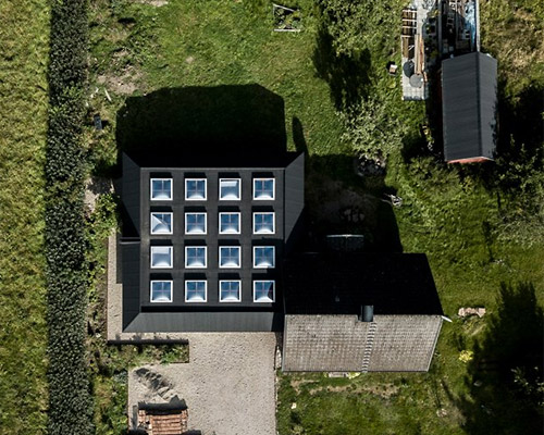 förstberg ling designs 'a house for two artists' with a grid of hidden skylights