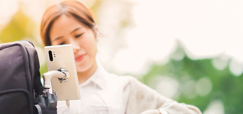 this japanese umbrella features a magnet holder so you can fix your smartphone on its handle