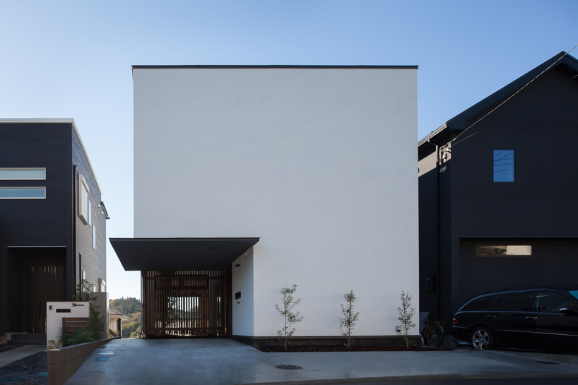 LEVEL architects conceals bright inner courtyard behind this house's blank façade in japan