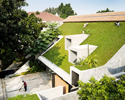 RAD+ar tops tropical residence in indonesia with green steep pitch roof