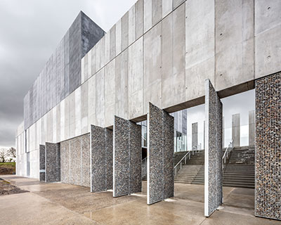 randja architects completes robust stone & concrete technology park in france