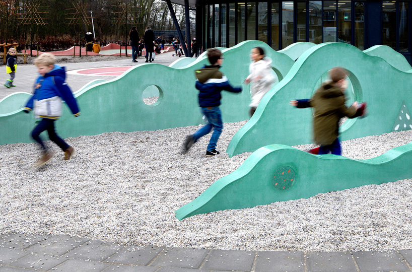 studio ossidiana creates colorful concrete landscape for school playground in the netherlands