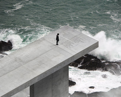 luiz eduardo lupatini designs a monumental concrete structure anchored off the algarve coast