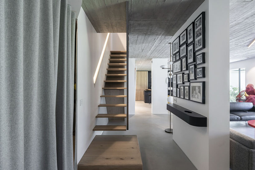 toledano + architects adds geometric wood + metal staircase to apartment in paris