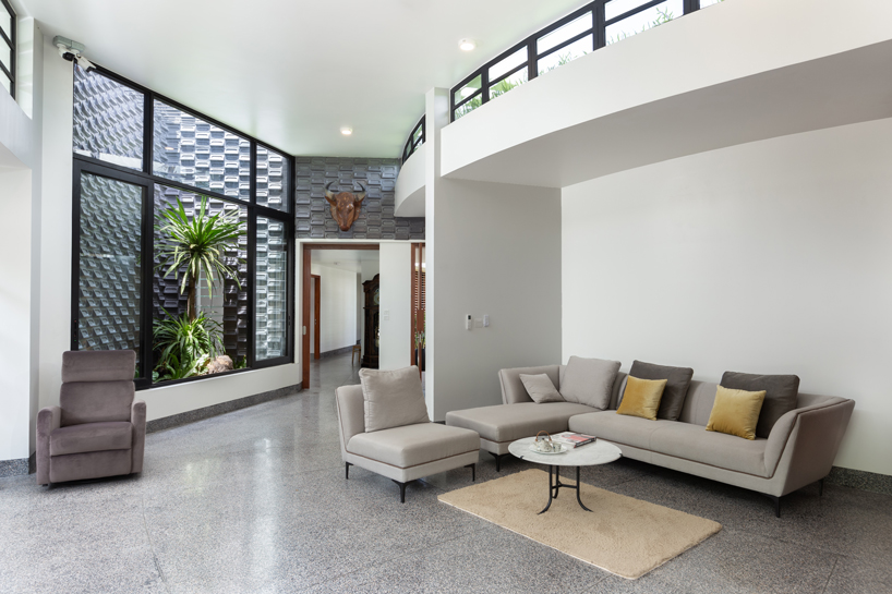 UAD architects tops 'the breeze house' in cambodia with a rooftop garden designboom