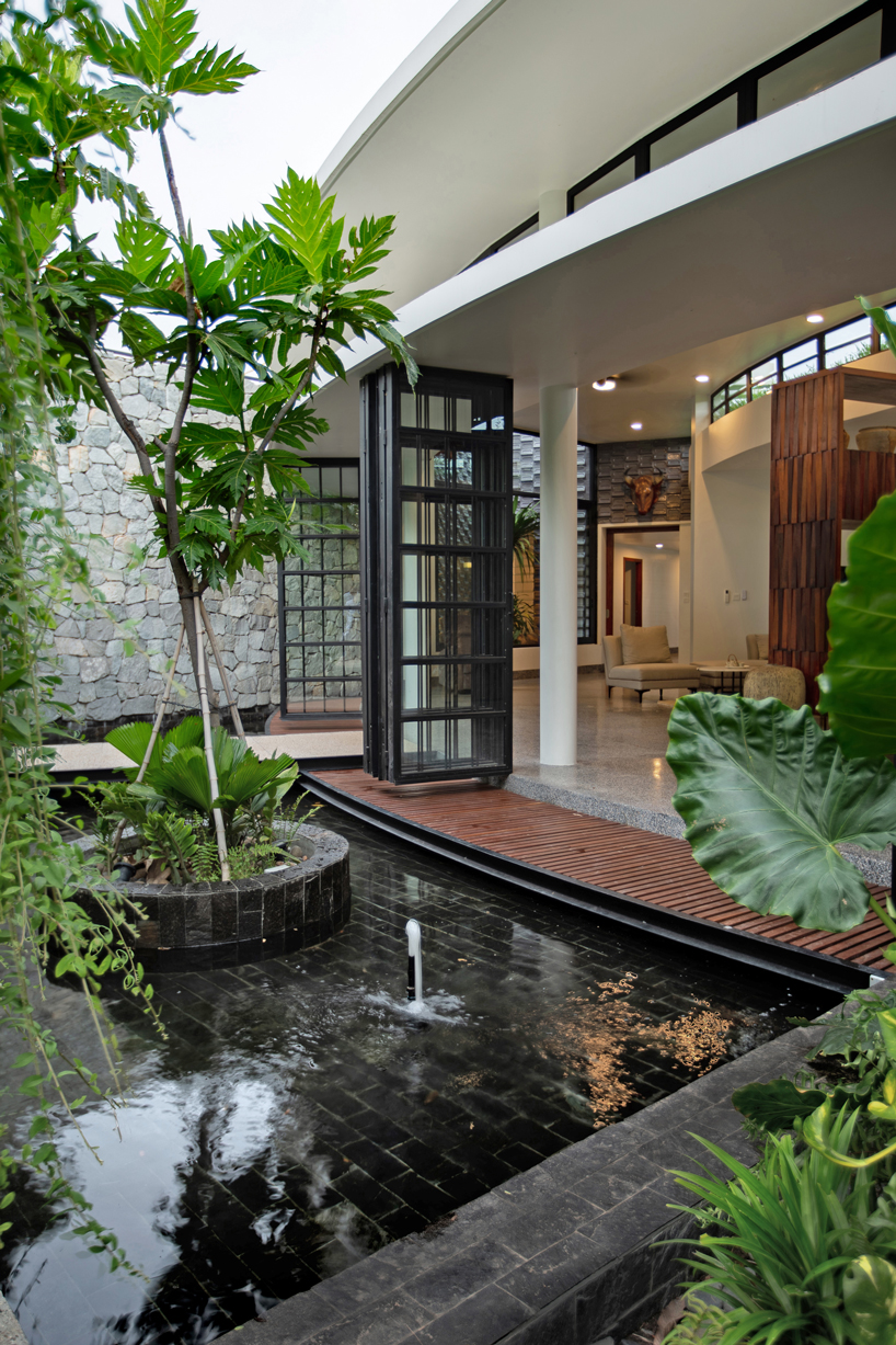 UAD architects tops 'the breeze house' in cambodia with a rooftop garden designboom