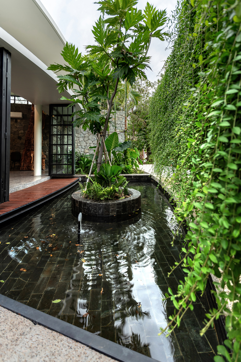 UAD architects tops 'the breeze house' in cambodia with a rooftop garden designboom