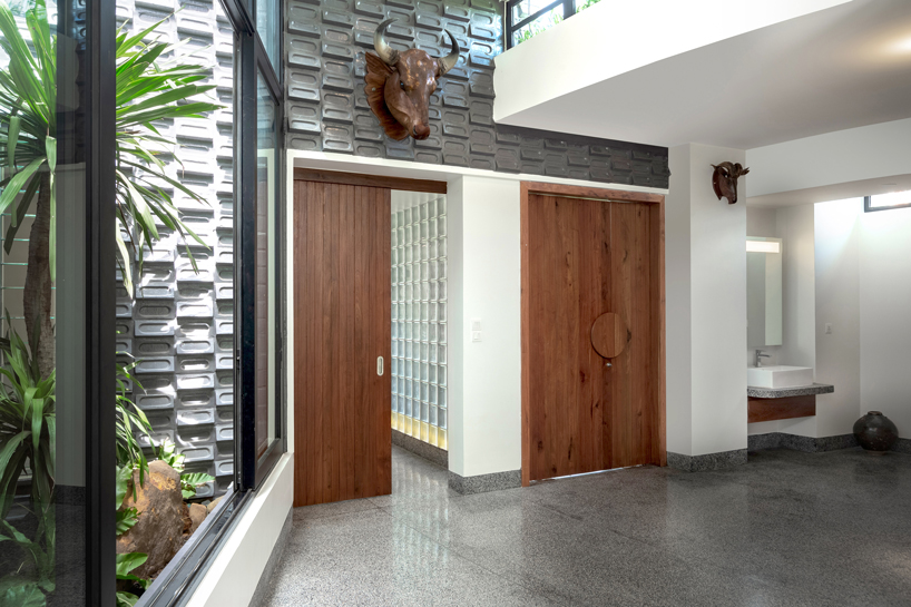 UAD architects tops 'the breeze house' in cambodia with a rooftop garden designboom