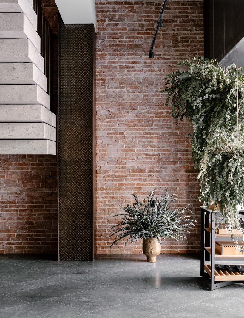 brick, bonze and plants in via.'s house of madison concept store in hong kong