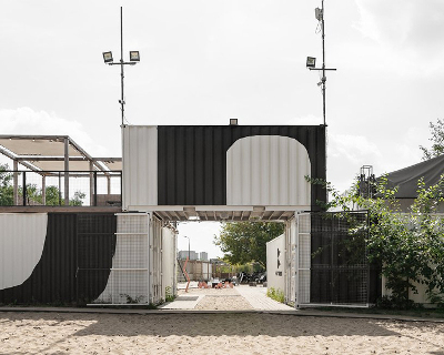 wiercinski studio recycles 23 shipping containers to build a cultural center in poznan