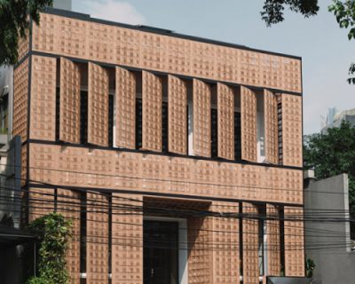 ZXC studio clads a coffee shop in jakarta with pivoting panels of rattan