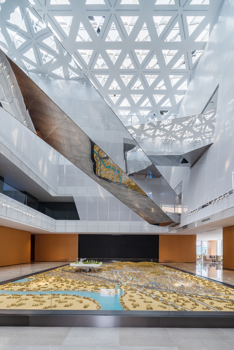 interior atrium with steel bridges in shuifa info town property exhibition center in china by aoe