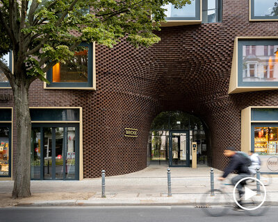 graft revitalizes historical post office complex in berlin with parametric brick façade
