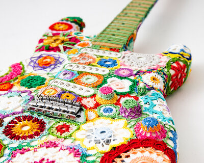 joana vasconcelos wraps a fender stratocaster guitar with technicolor floral crochet