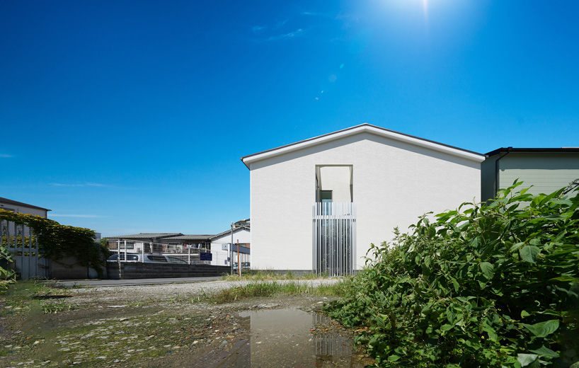jun murata completes japanese guesthouse with small courtyard where light + shadow play