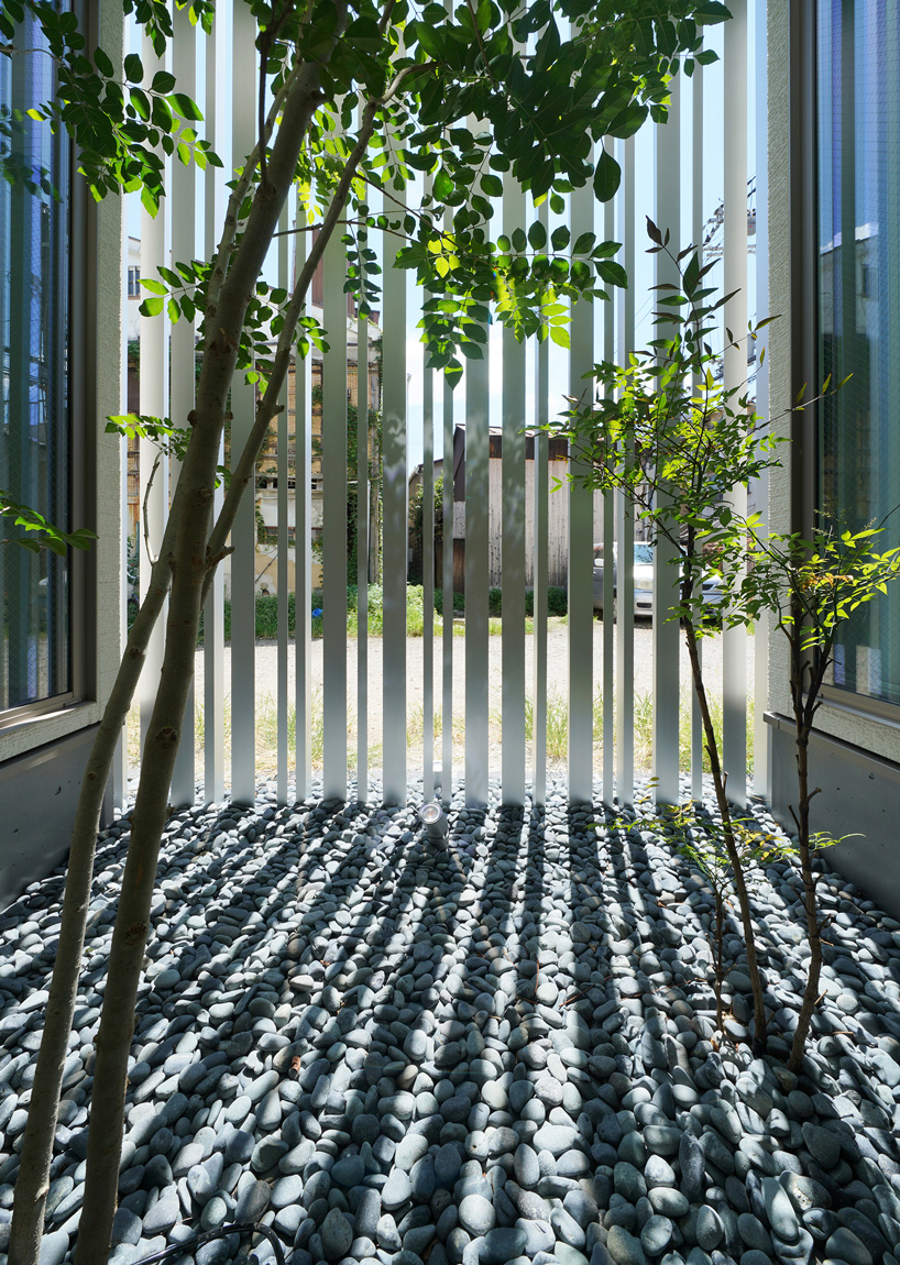 jun murata completes japanese guesthouse with small courtyard where light + shadow play