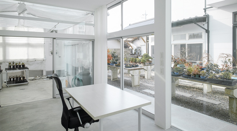 office desk looking toward the garden through large fixed windows