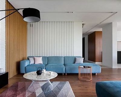 patterned flooring & accents of color complete minimalist residential interior in poland