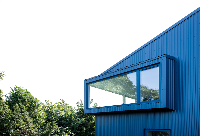 blue corrugated steel exterior and large window