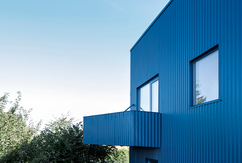 blue corrugated steel exterior and balcony