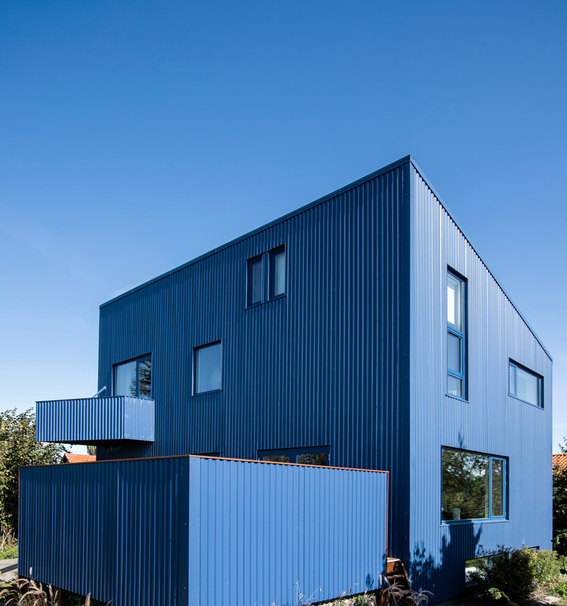 sigurd larsen clads monolithic danish house in blue corrugated steel
