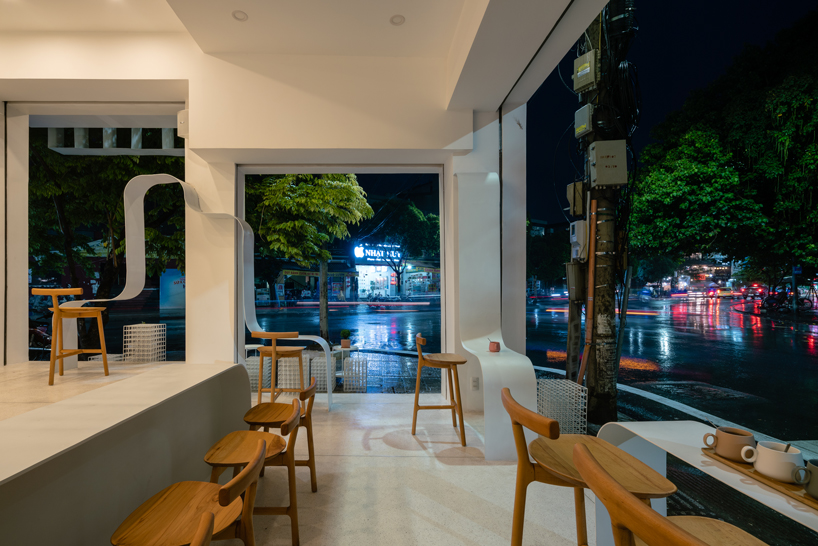 NKAA stacks a café and family home onto a corner site in hue, vietnam designboom