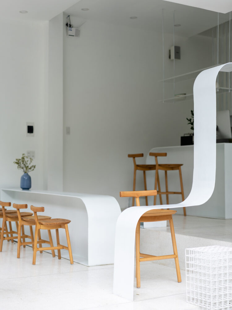 NKAA stacks a café and family home onto a corner site in hue, vietnam designboom