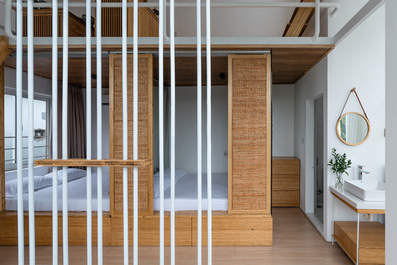 NKAA stacks a café and family home onto a corner site in hue, vietnam designboom