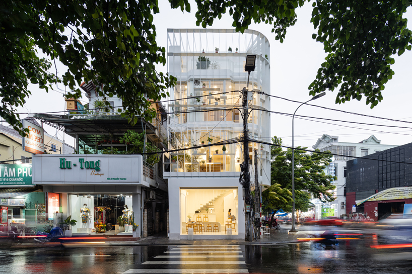 NKAA stacks a café and family home onto a corner site in hue, vietnam designboom
