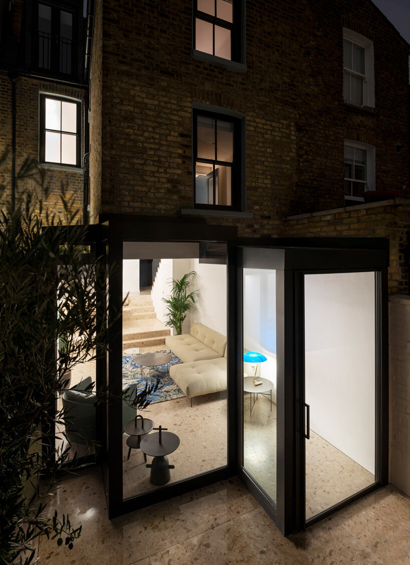 bureau de change adds interlocking geometric glass extension to victorian house in london
