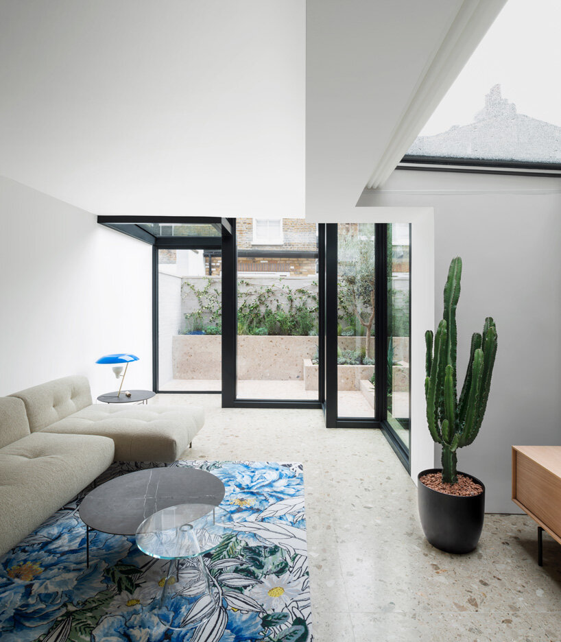 bureau de change adds interlocking geometric glass extension to victorian house in london
