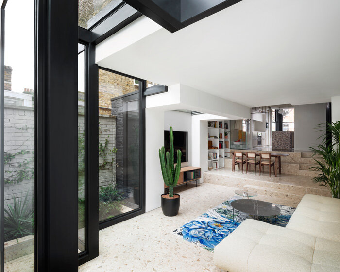 bureau de change adds interlocking geometric glass extension to victorian house in london