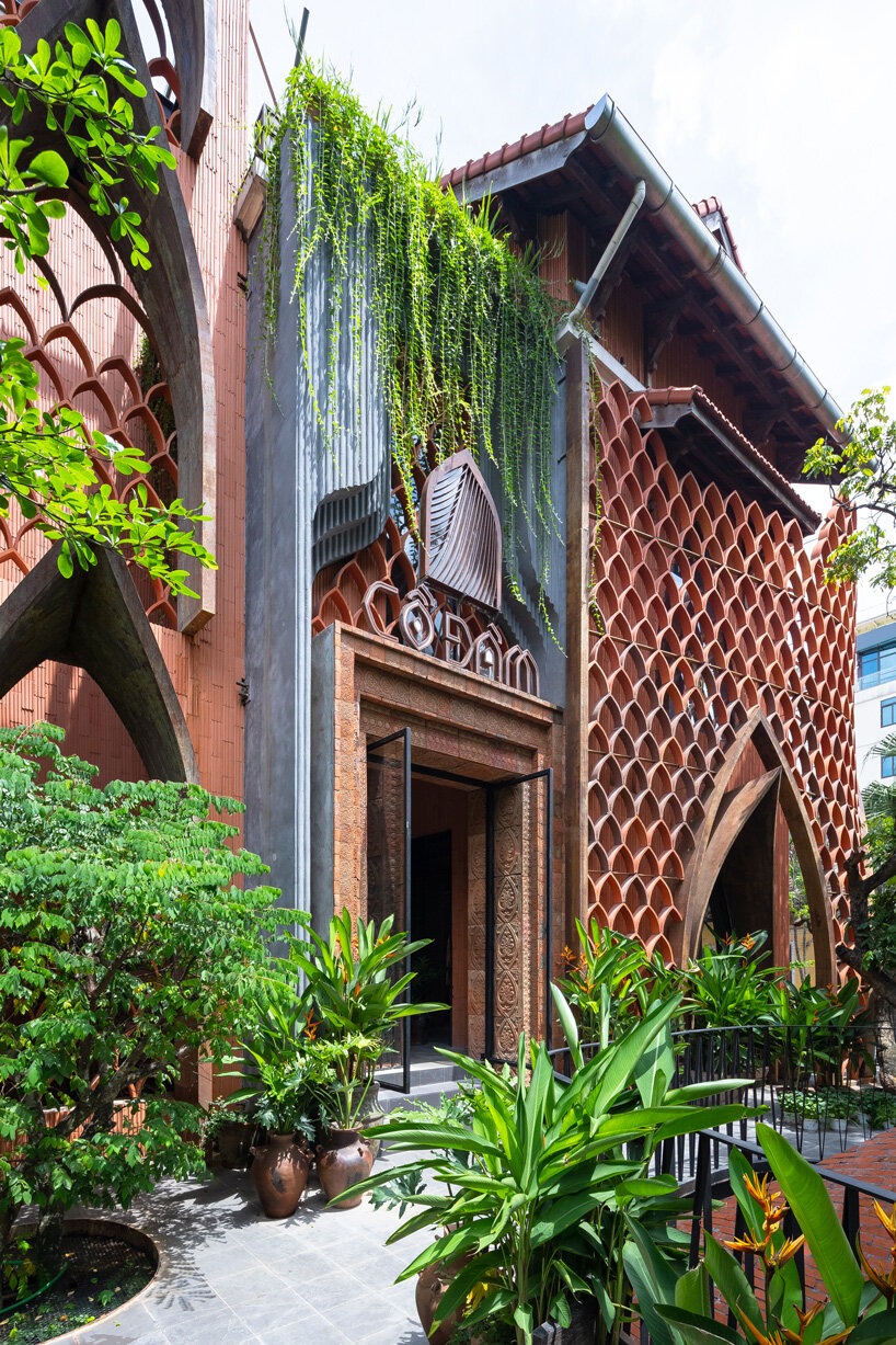 le house designs vegetarian restaurant in vietnam to resemble a champa red brick temple