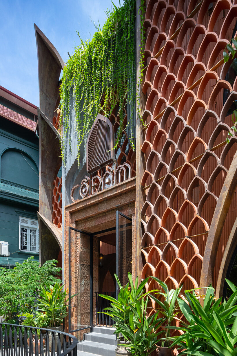 le house designs vegetarian restaurant in vietnam to resemble a champa red brick temple