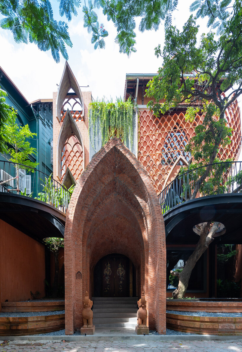 entrance- le house designs vegetarian restaurant in vietnam to resemble a champa red brick temple