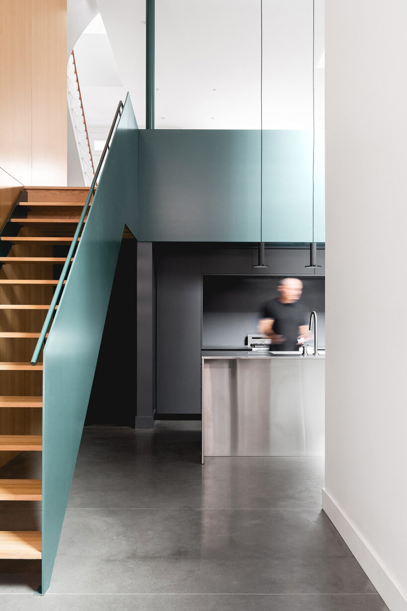 staircase and kitchen in naturehumaine house renovation canada