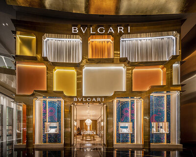 MVRDV references bulgari's first store in rome with brass and glass façade in bangkok