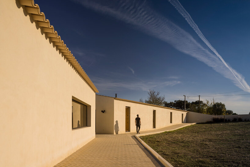 bica arquitectos combines two contiguous volumes into 'house in alentejo' in rural portugal