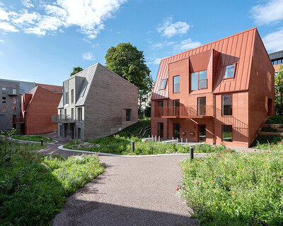 CEBRA creates a 'cozy cobbled streetscape' for apartments in aarhus, denmark