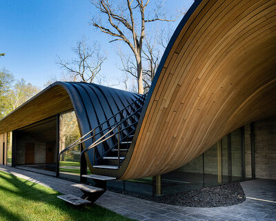 PARTISANS sculpts 'fold house' in ontario to embrace the contours of its hillside site